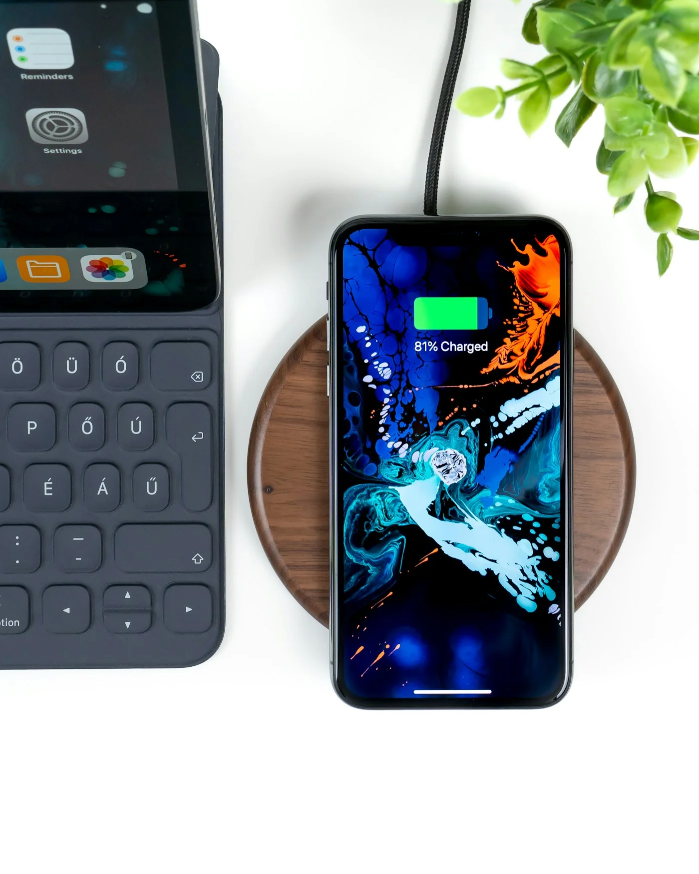 Smartphone on wireless charging dock at desk
